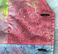 Detail of front edge of marbled fabric vest