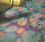 Dropping Floating color on marbling bath